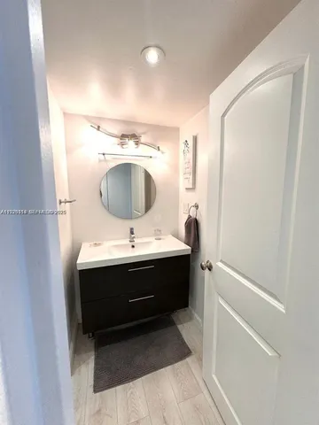 a bathroom with a sink and mirror