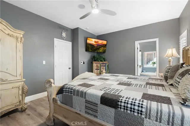 a swimming pool with outdoor seating and trees