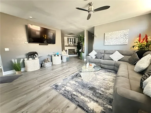 a room with furniture and a potted plant