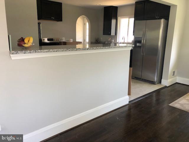 308 Penn Road Pasadena, MD 21122 - Photo 10 of 54 Breakfast bar. Large cabinets on other side
