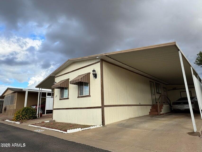 8600 East Broadway Road, Unit 58 Mesa, AZ 85208 - Photo 5 of 13 a house with a outdoor space