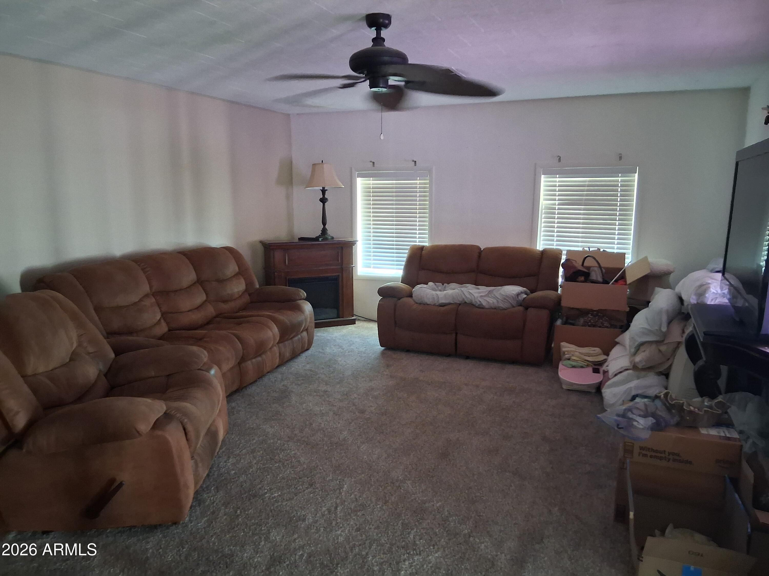8600 East Broadway Road, Unit 58 Mesa, AZ 85208 - Photo 6 of 13 a living room with furniture
