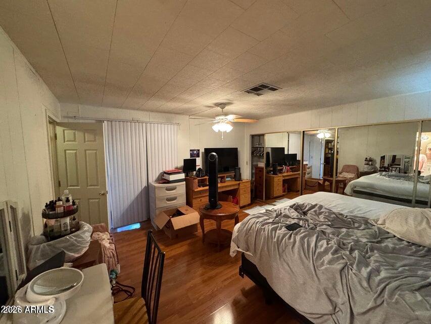 8600 East Broadway Road, Unit 58 Mesa, AZ 85208 - Photo 7 of 13 a bed room with bed and a couch