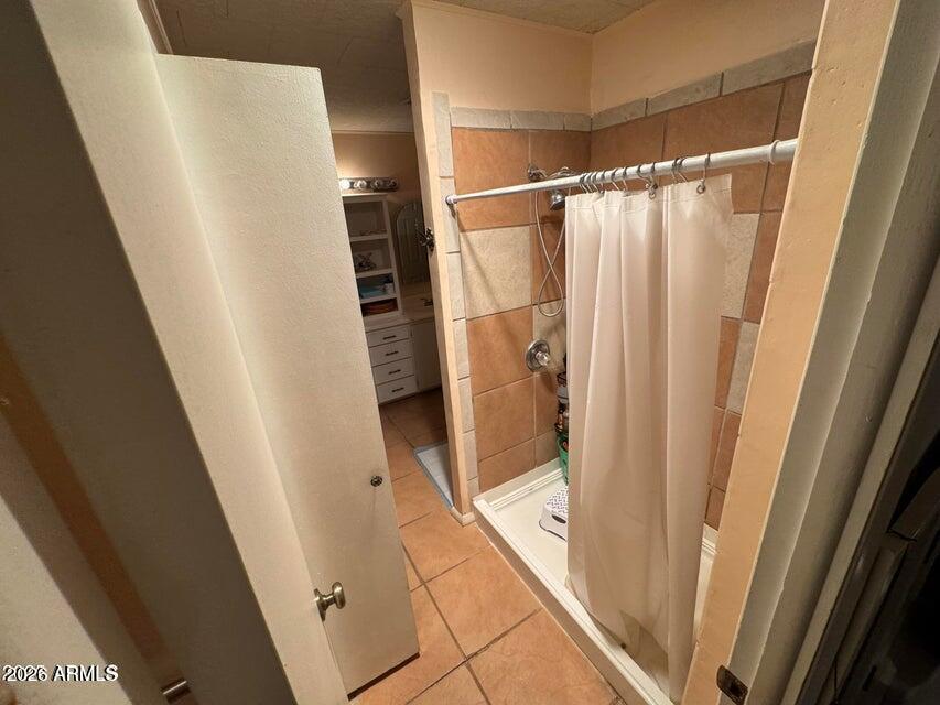 8600 East Broadway Road, Unit 58 Mesa, AZ 85208 - Photo 9 of 13 a bathroom with a shower and a tub