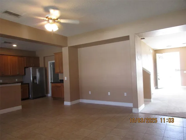 a view of a hallway with a kitchen
