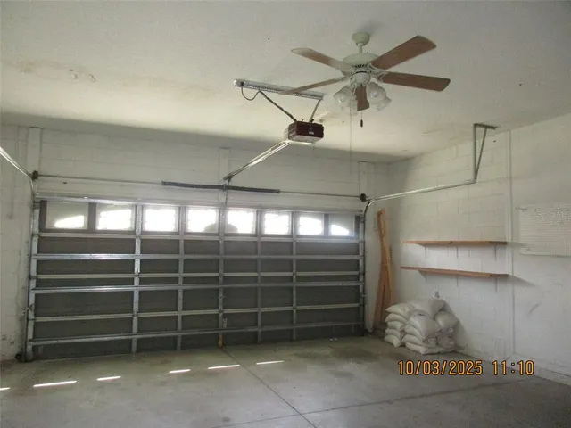 a view of a livingroom with furniture and staircase