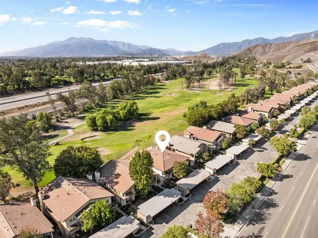 an aerial view of residential houses with outdoor space