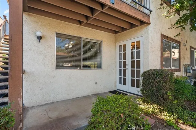 a view of potted plants in front of a door