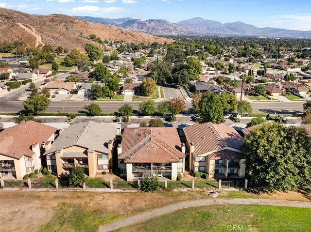 an aerial view of residential houses and outdoor space