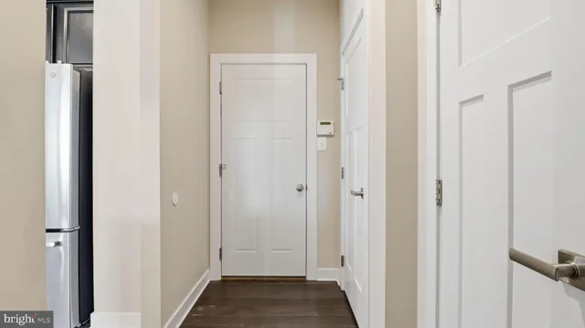 a view of a hallway with the wooden floor