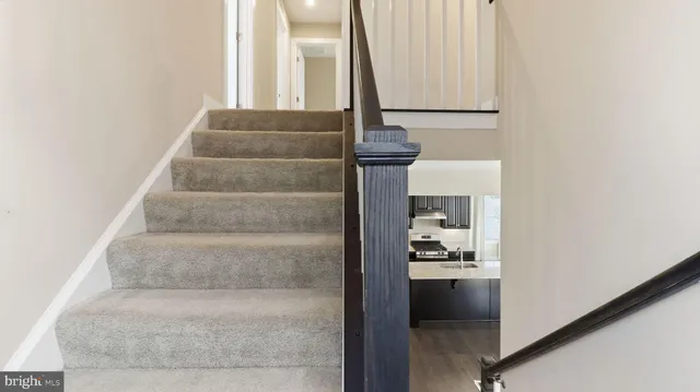 a view of staircase with white walls