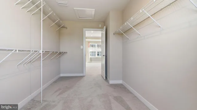 a bathroom with a granite countertop sink a toilet and a large mirror