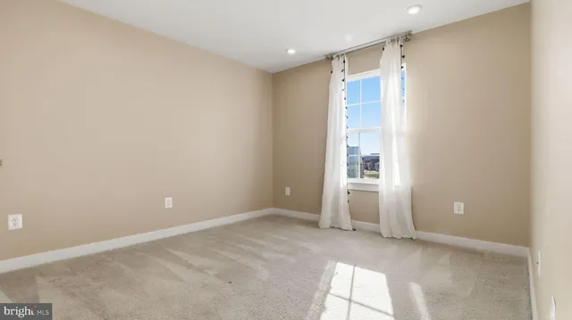 a bathroom with a granite countertop sink and a mirror with toilet