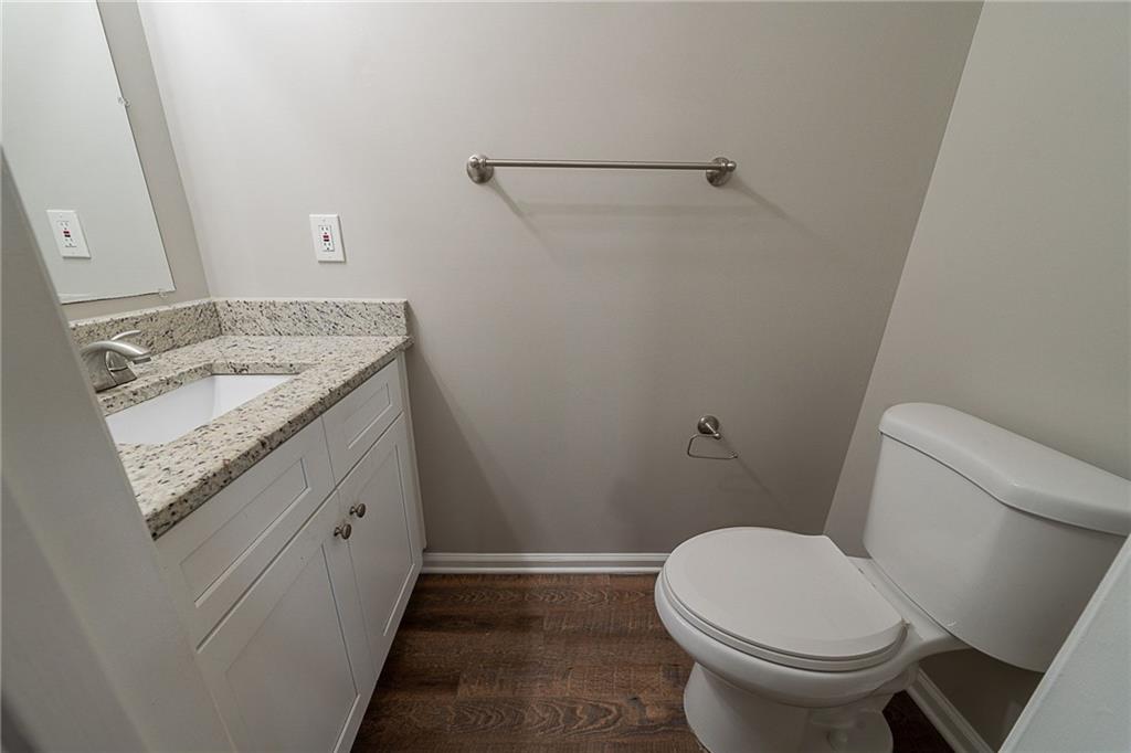 2183 Ramblewood Circle Decatur, GA 30035 - Photo 23 of 37 a bathroom with a granite countertop toilet and a sink