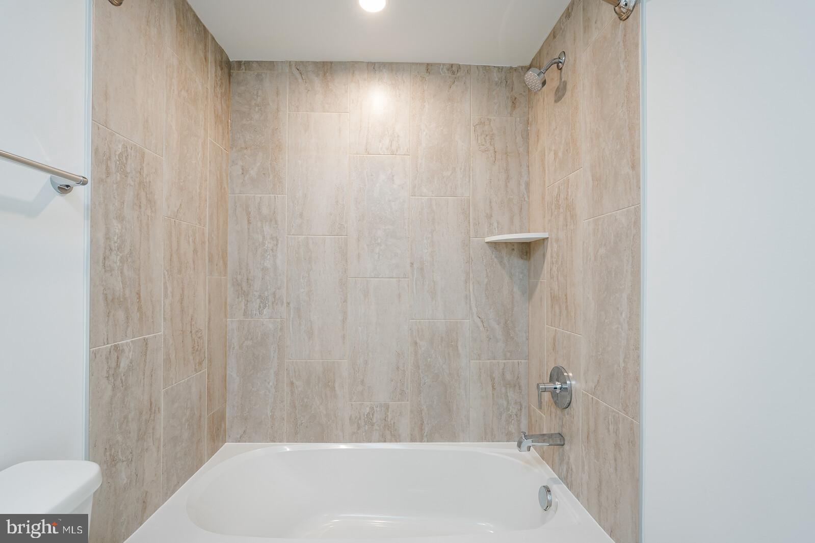 5345 Zenith Overlook Bethesda, MD 20816 - Photo 9 of 53 a bathroom with a shower and a tub