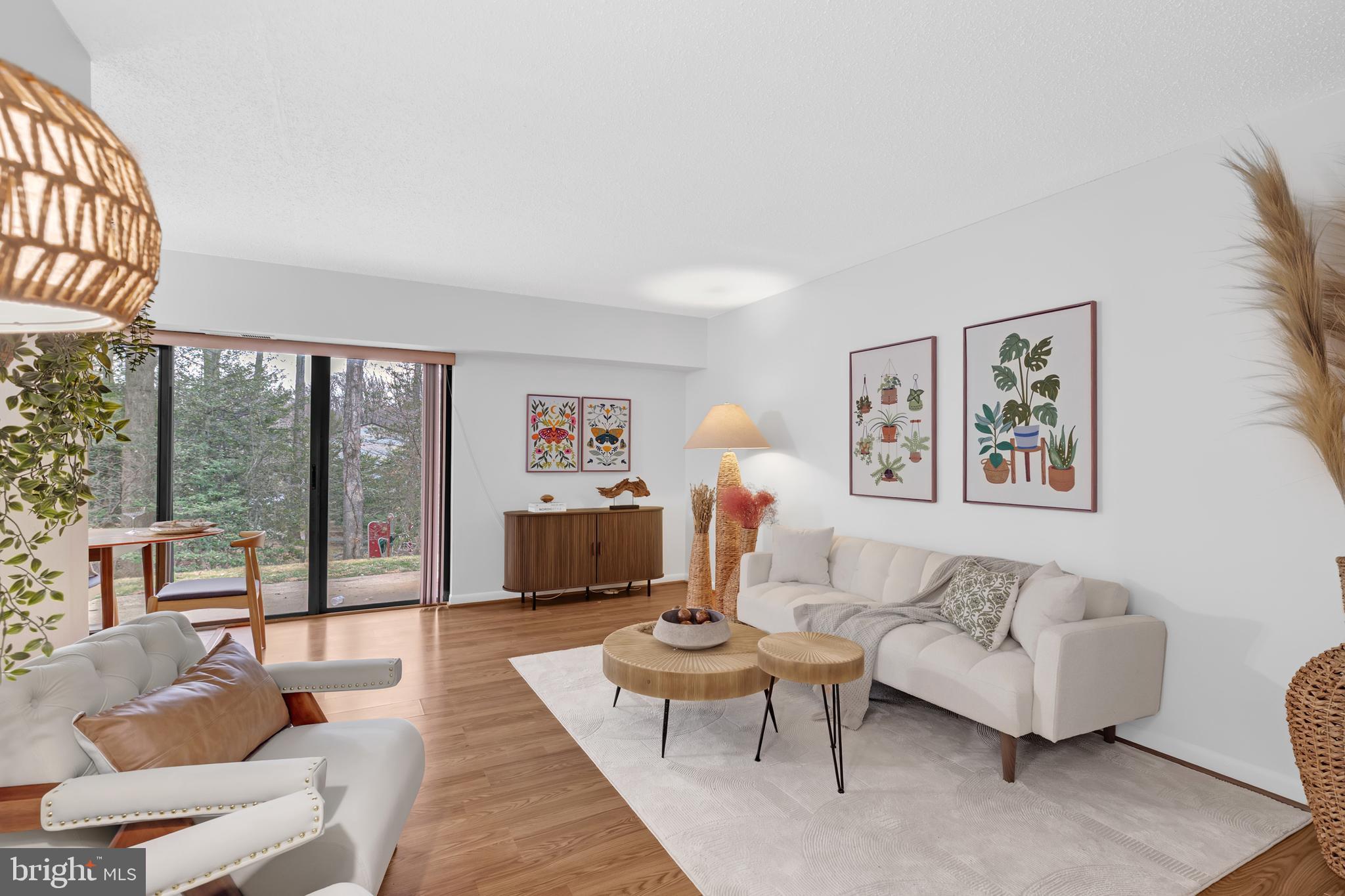 11637 Stoneview Square, Unit 2B Reston, VA 20191 - Photo 1 of 31 a living room with furniture and a large window