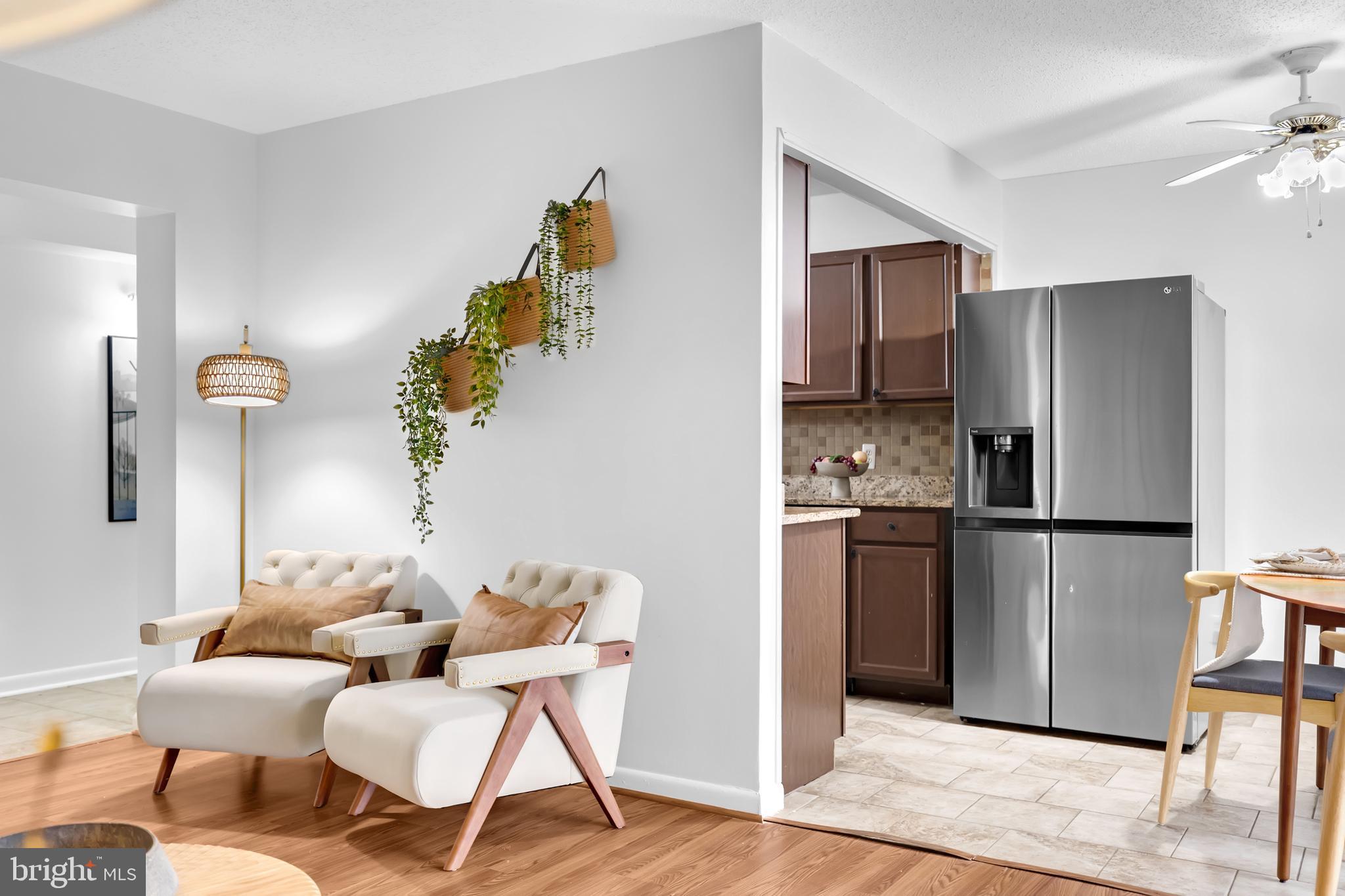 11637 Stoneview Square, Unit 2B Reston, VA 20191 - Photo 11 of 31 a kitchen with stainless steel appliances granite countertop a refrigerator and a stove top oven