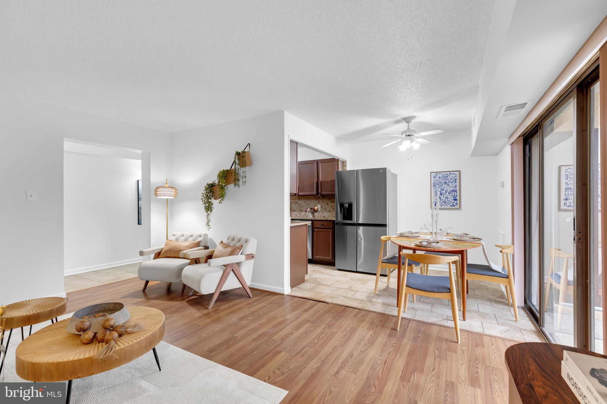 11637 Stoneview Square, Unit 2B Reston, VA 20191 - Photo 13 of 31 a living room with furniture and kitchen view