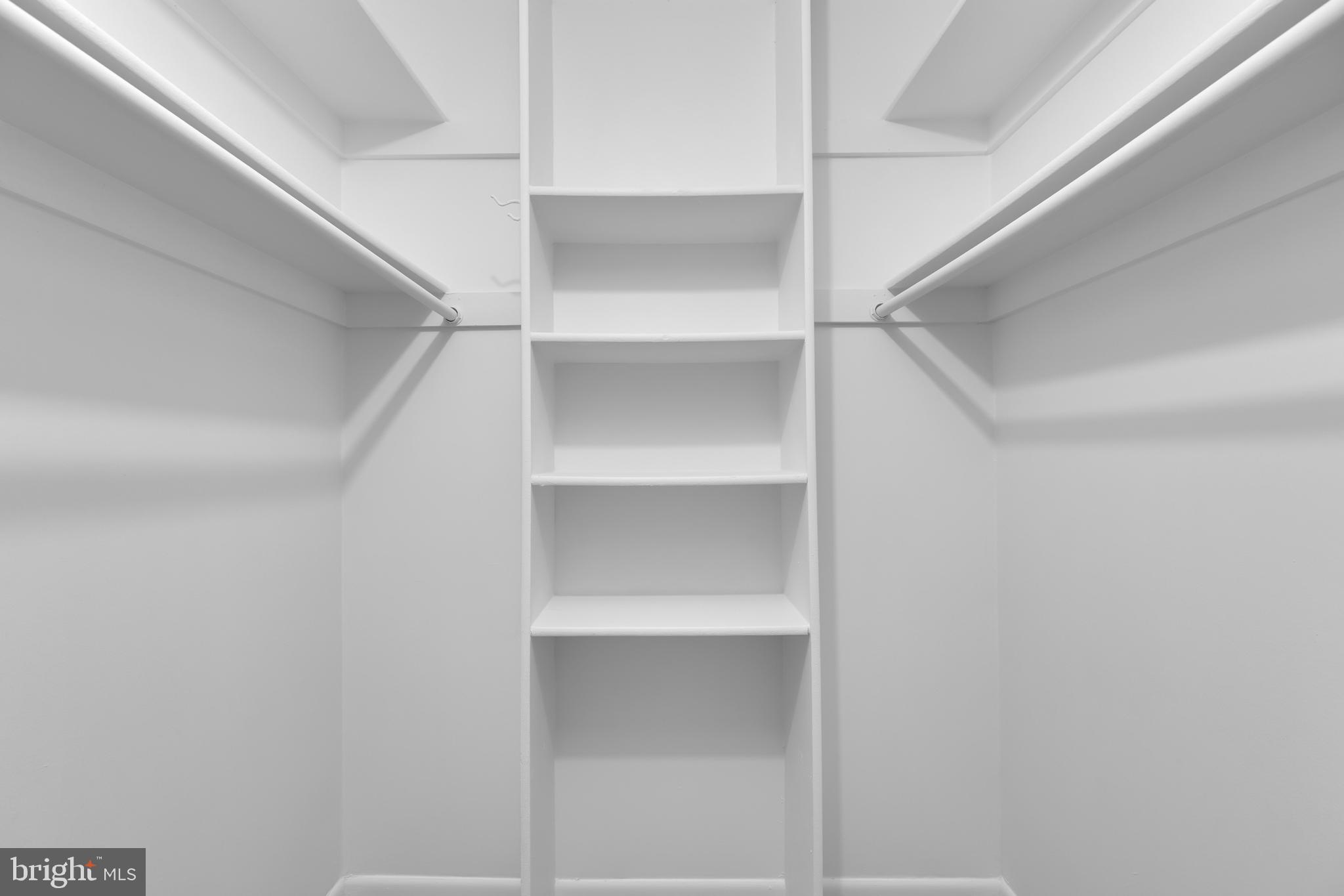 11637 Stoneview Square, Unit 2B Reston, VA 20191 - Photo 21 of 31 a view of an empty walk in closet