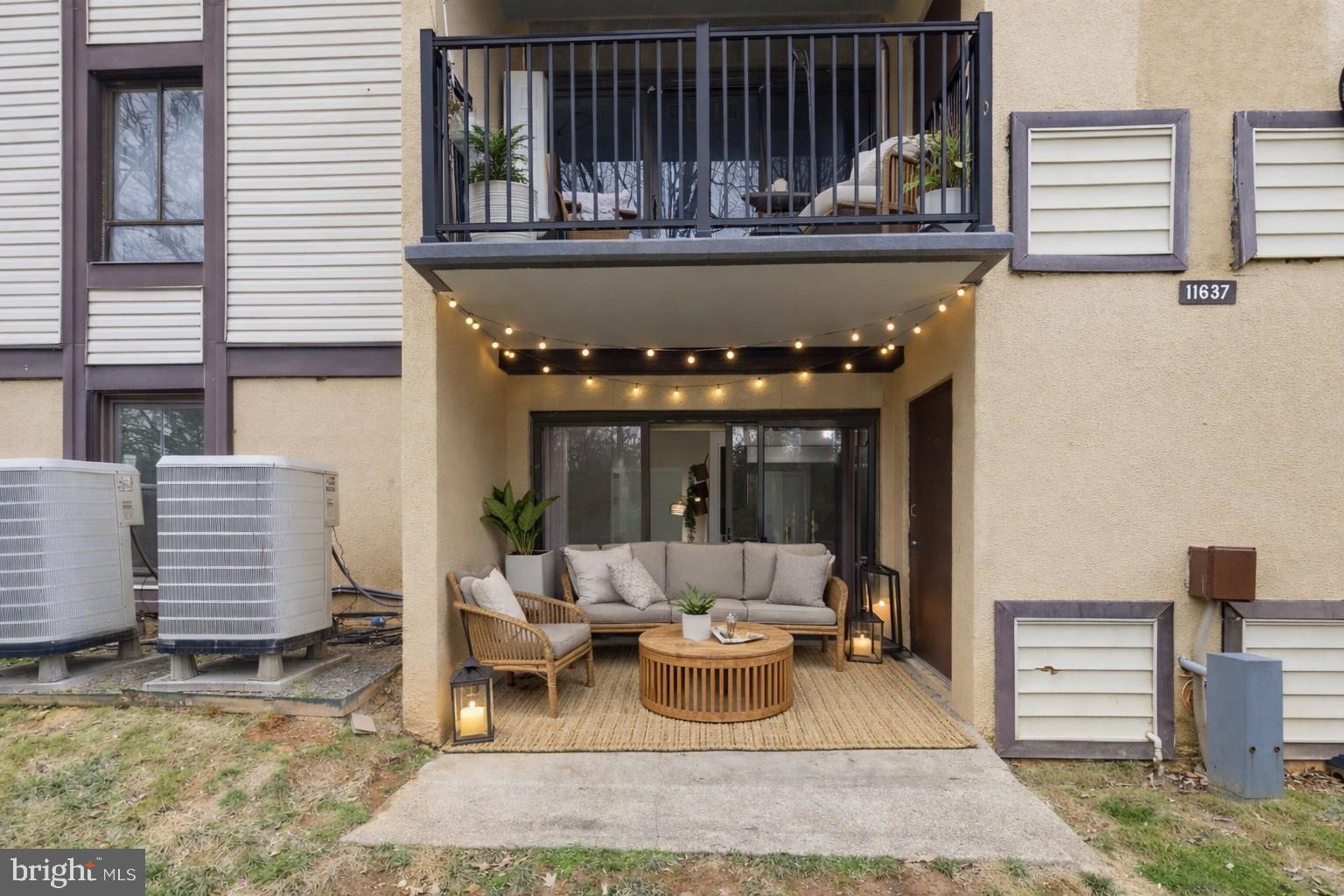 11637 Stoneview Square, Unit 2B Reston, VA 20191 - Photo 26 of 31 a view of a patio with dining table and chairs