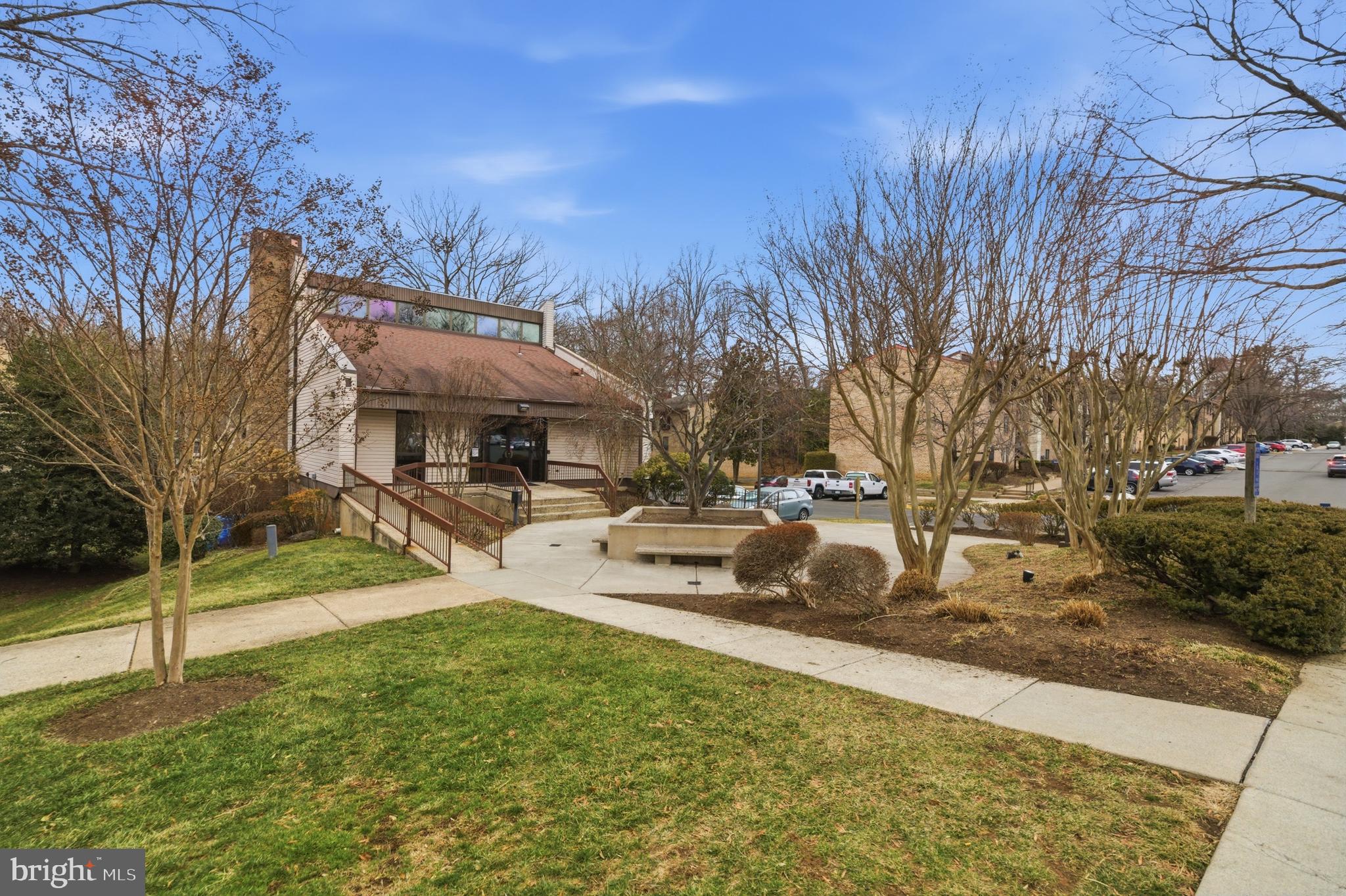 11637 Stoneview Square, Unit 2B Reston, VA 20191 - Photo 28 of 31 a view of a house with a yard