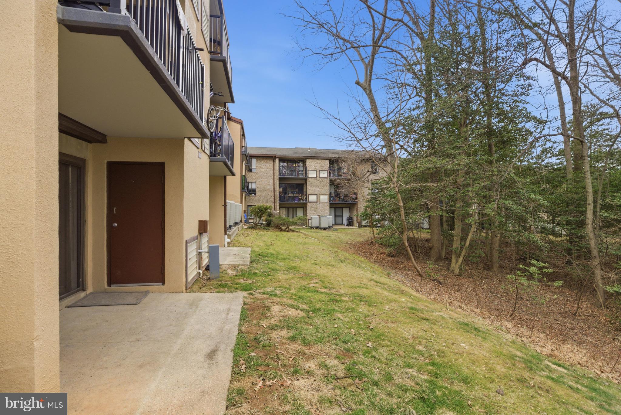 11637 Stoneview Square, Unit 2B Reston, VA 20191 - Photo 29 of 31 a view of an house with backyard and trees