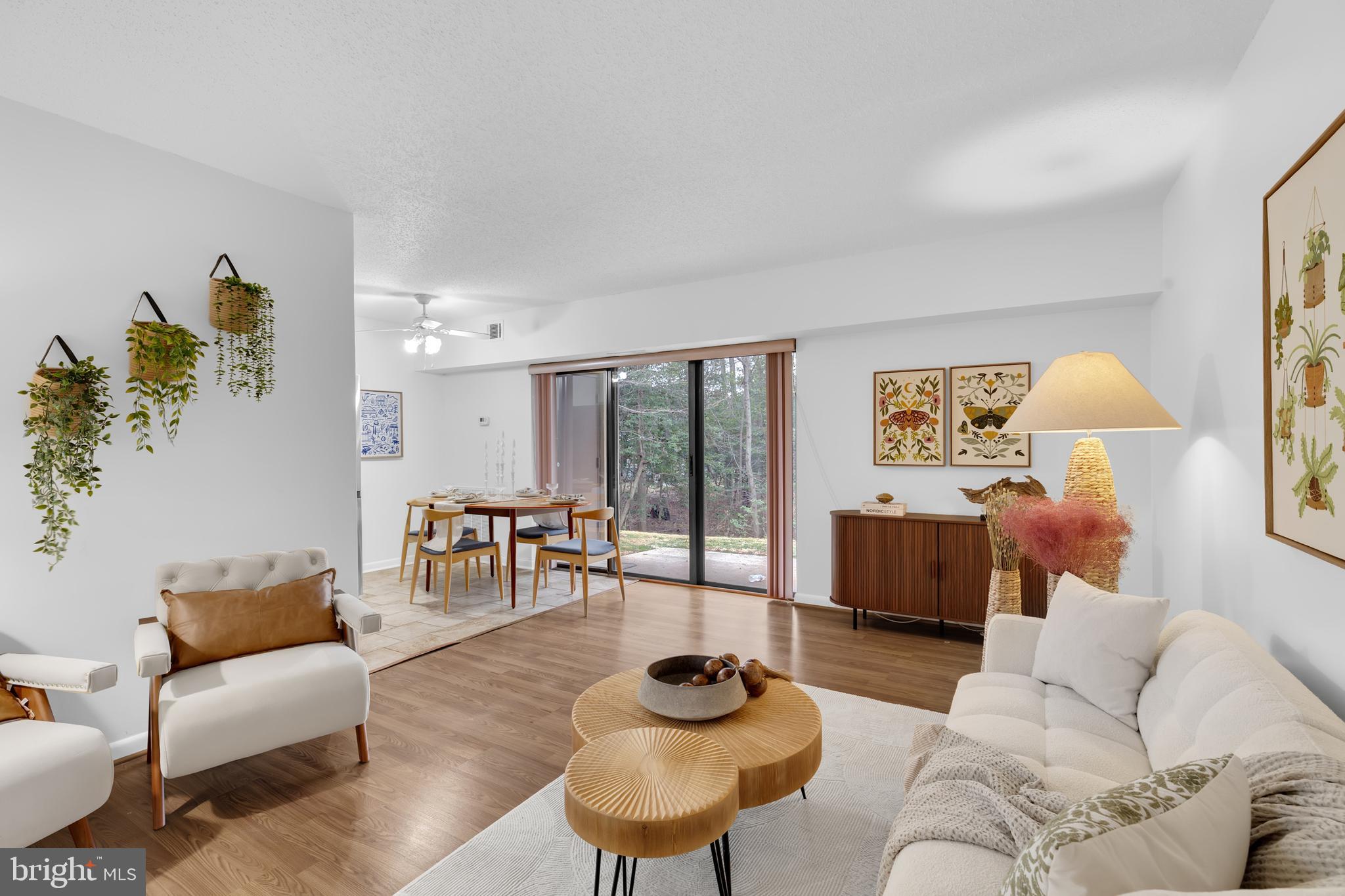 11637 Stoneview Square, Unit 2B Reston, VA 20191 - Photo 8 of 31 a living room with furniture and a large window