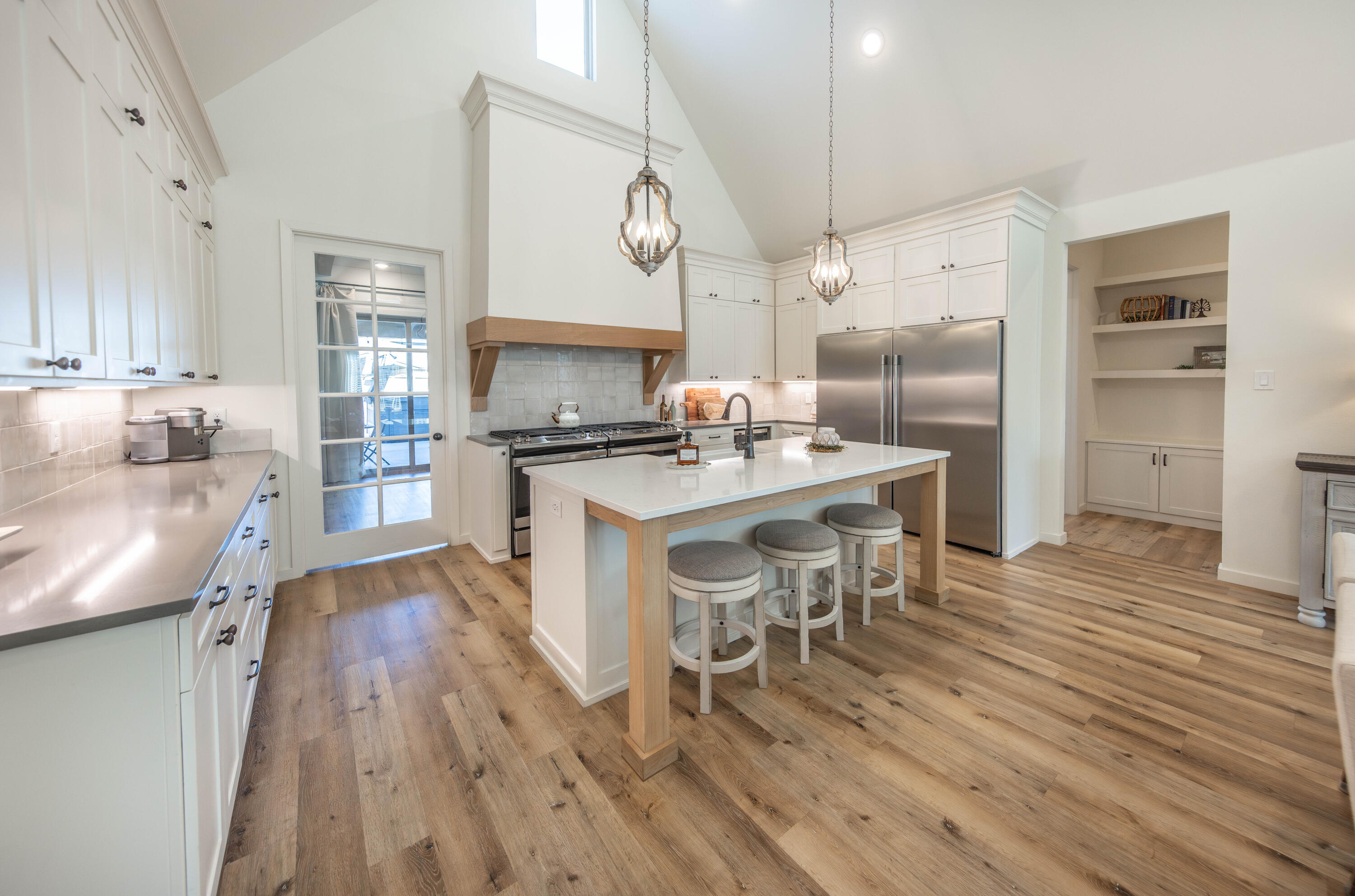 3816 128th Street Lubbock, TX 79423 - Photo 12 of 38 a large kitchen with a table and chairs in it