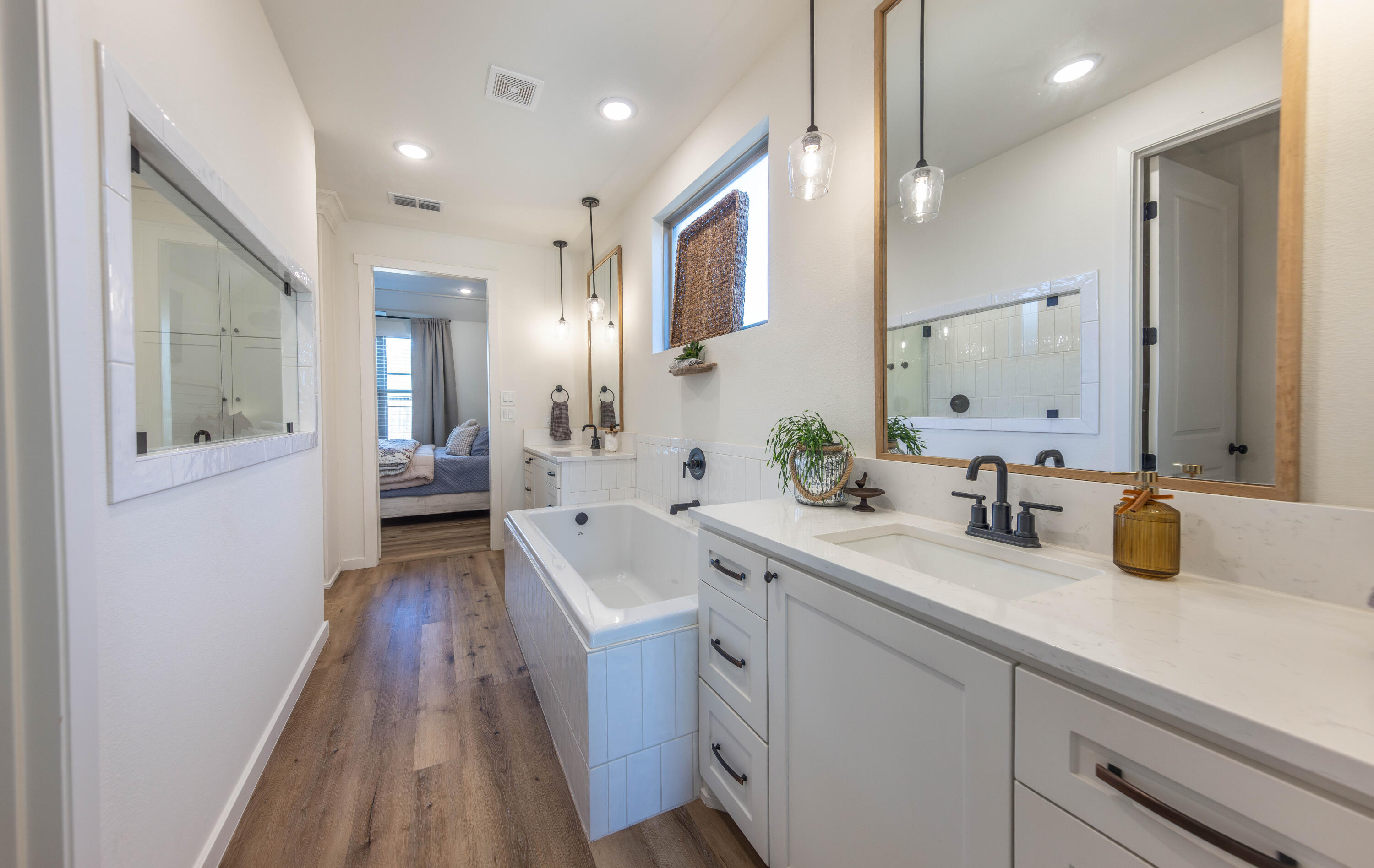 3816 128th Street Lubbock, TX 79423 - Photo 22 of 38 a spacious bathroom with a double vanity sink and mirror