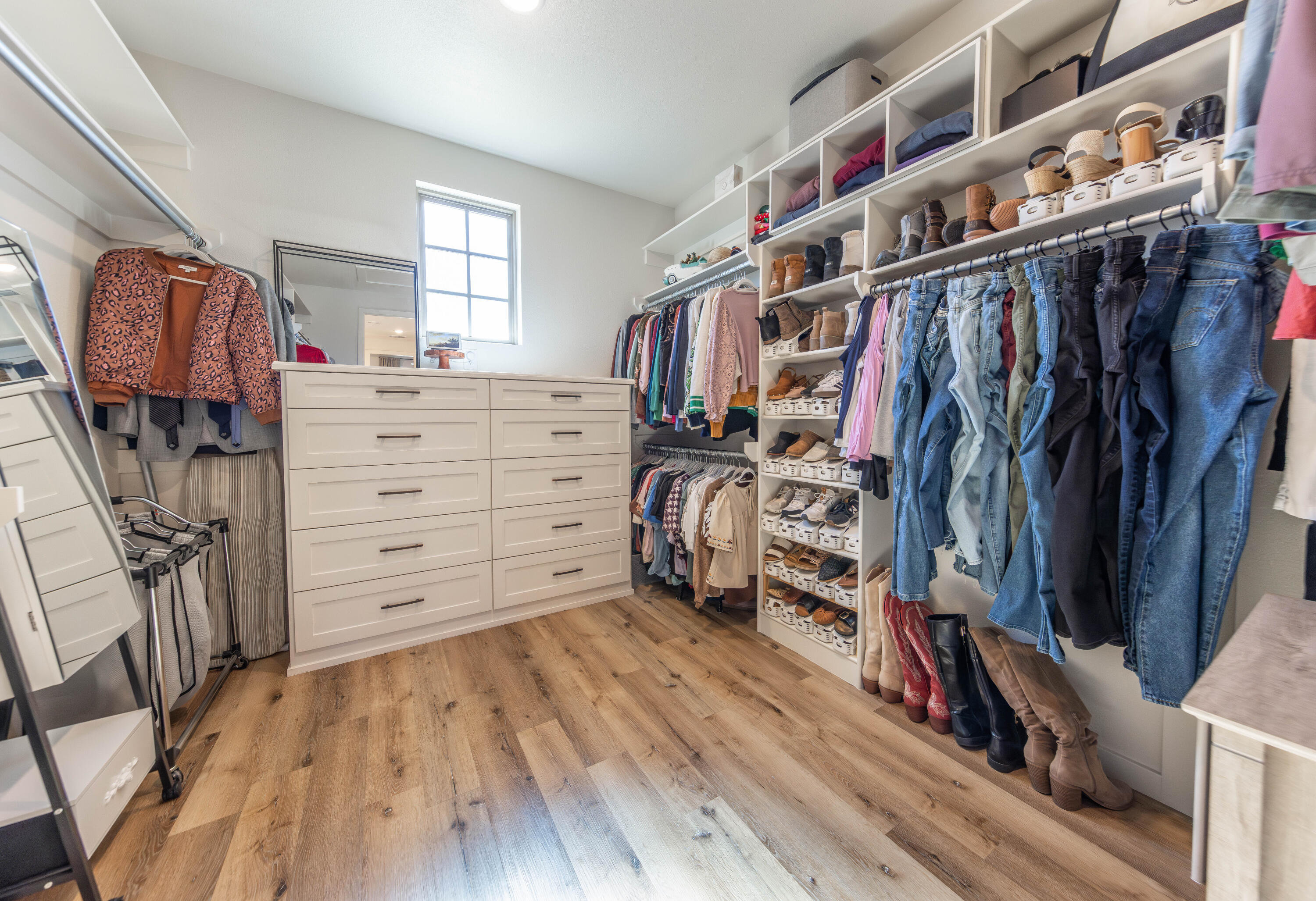 3816 128th Street Lubbock, TX 79423 - Photo 23 of 38 a view of walk in closet with clothes and shoes