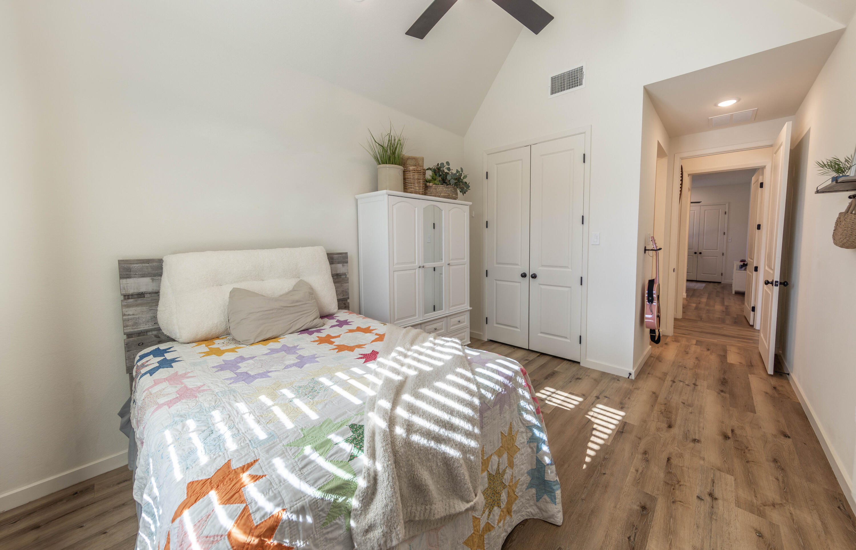 3816 128th Street Lubbock, TX 79423 - Photo 29 of 38 a bedroom with a bed and wooden floor