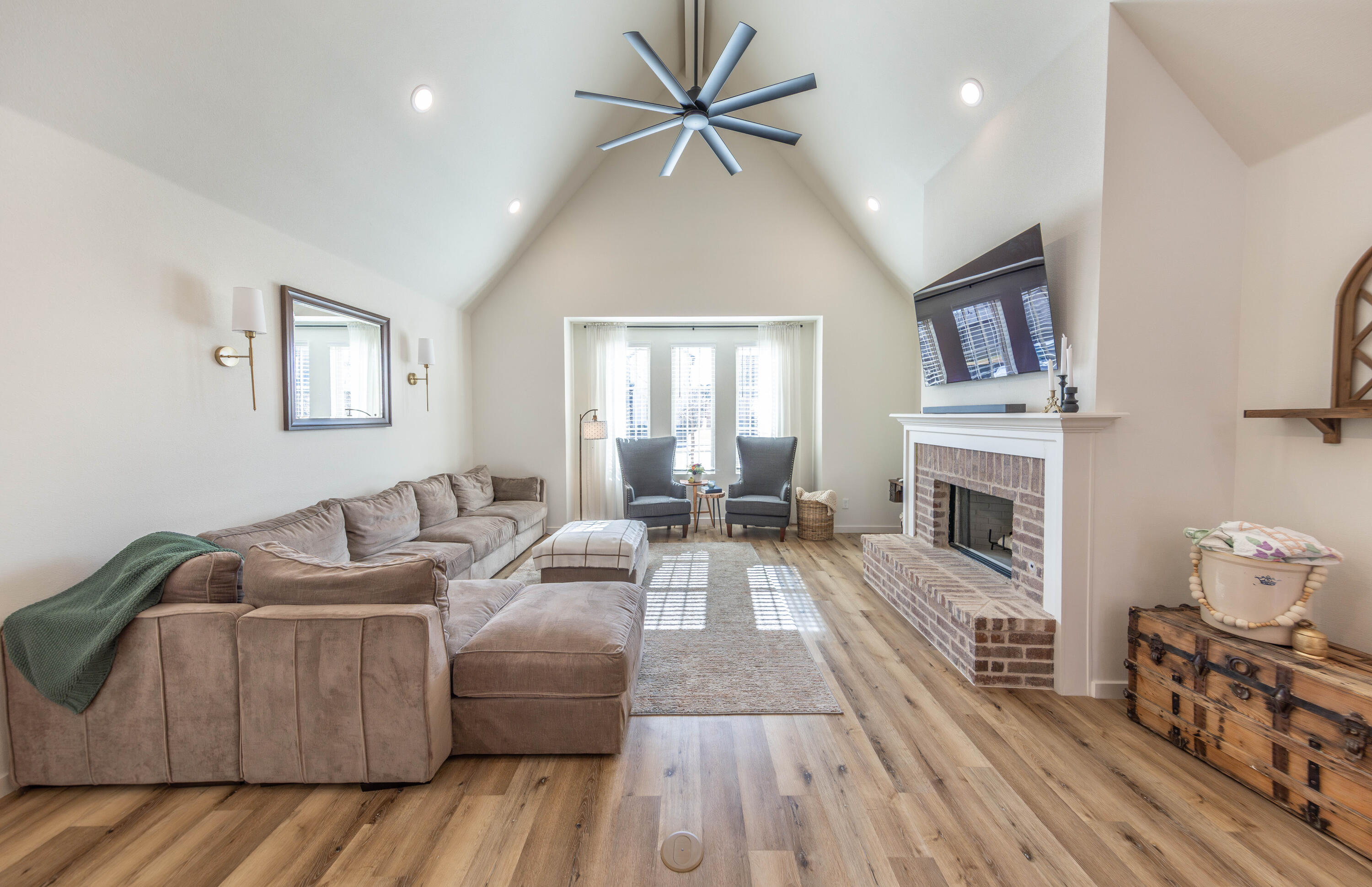 3816 128th Street Lubbock, TX 79423 - Photo 8 of 38 a living room with furniture and a fireplace