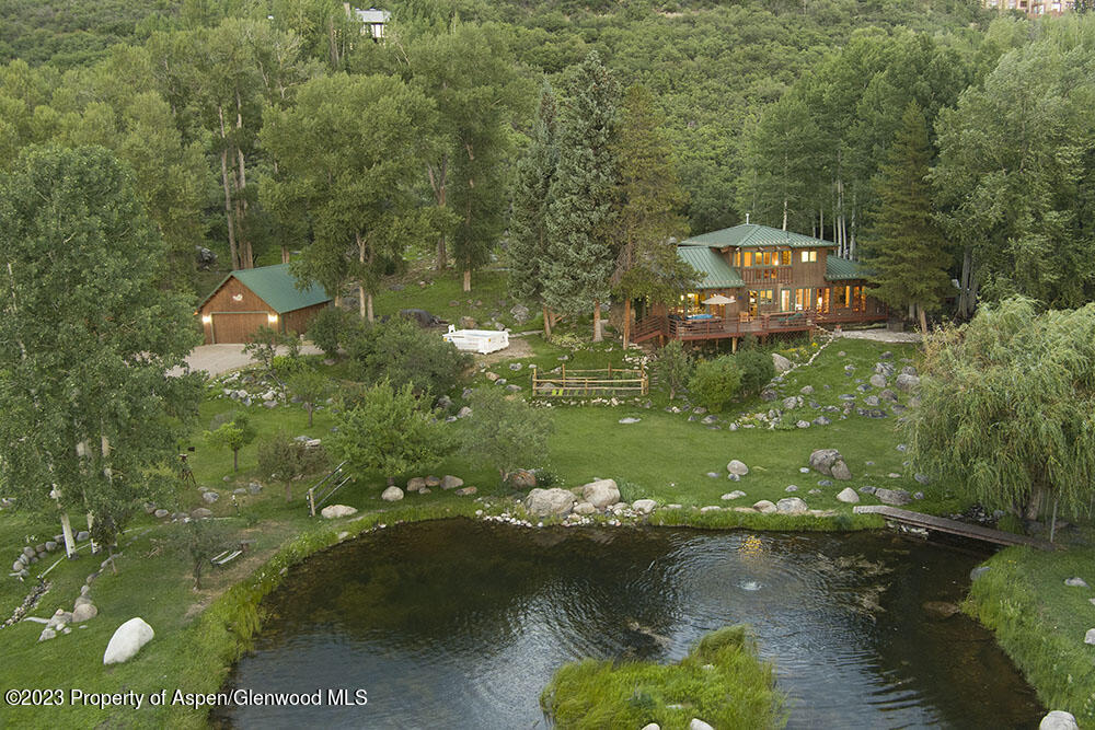209 East Reds Road Aspen, CO 81612 - Photo 13 of 26 a view of a lake with a yard