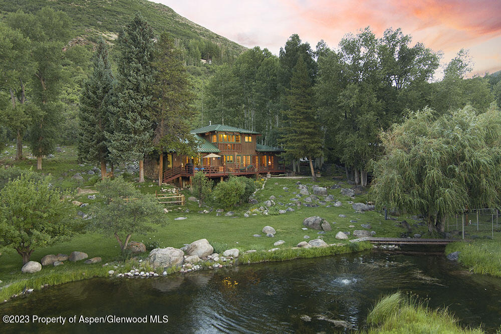 209 East Reds Road Aspen, CO 81612 - Photo 15 of 26 a backyard of a house with lots of green space