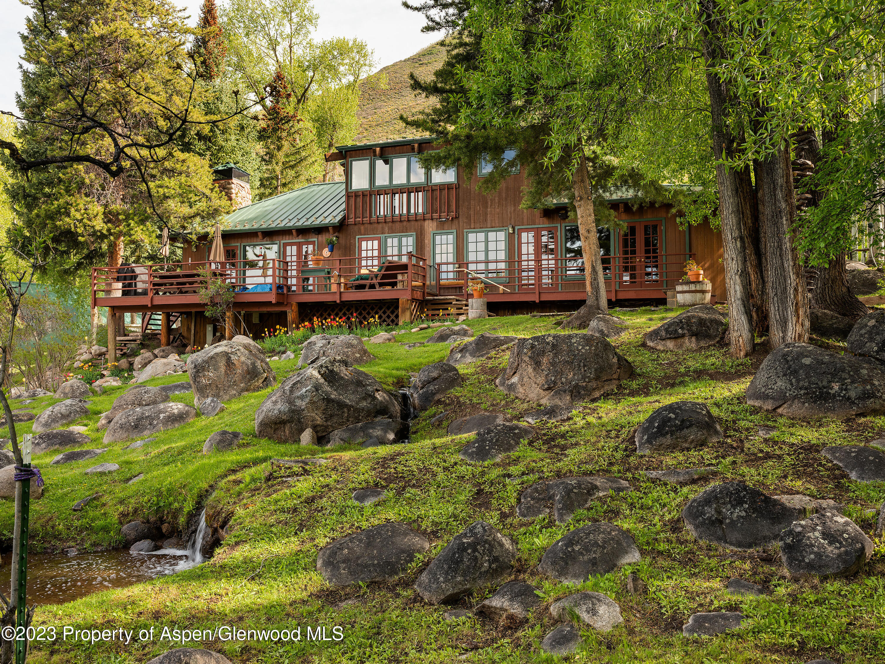 209 East Reds Road Aspen, CO 81612 - Photo 16 of 26 a view of house with yard and sitting area