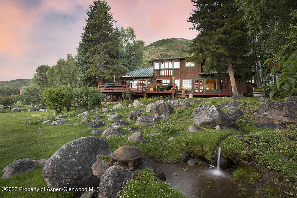 209 East Reds Road Aspen, CO 81612 - Photo 17 of 26 a front view of a house with a yard