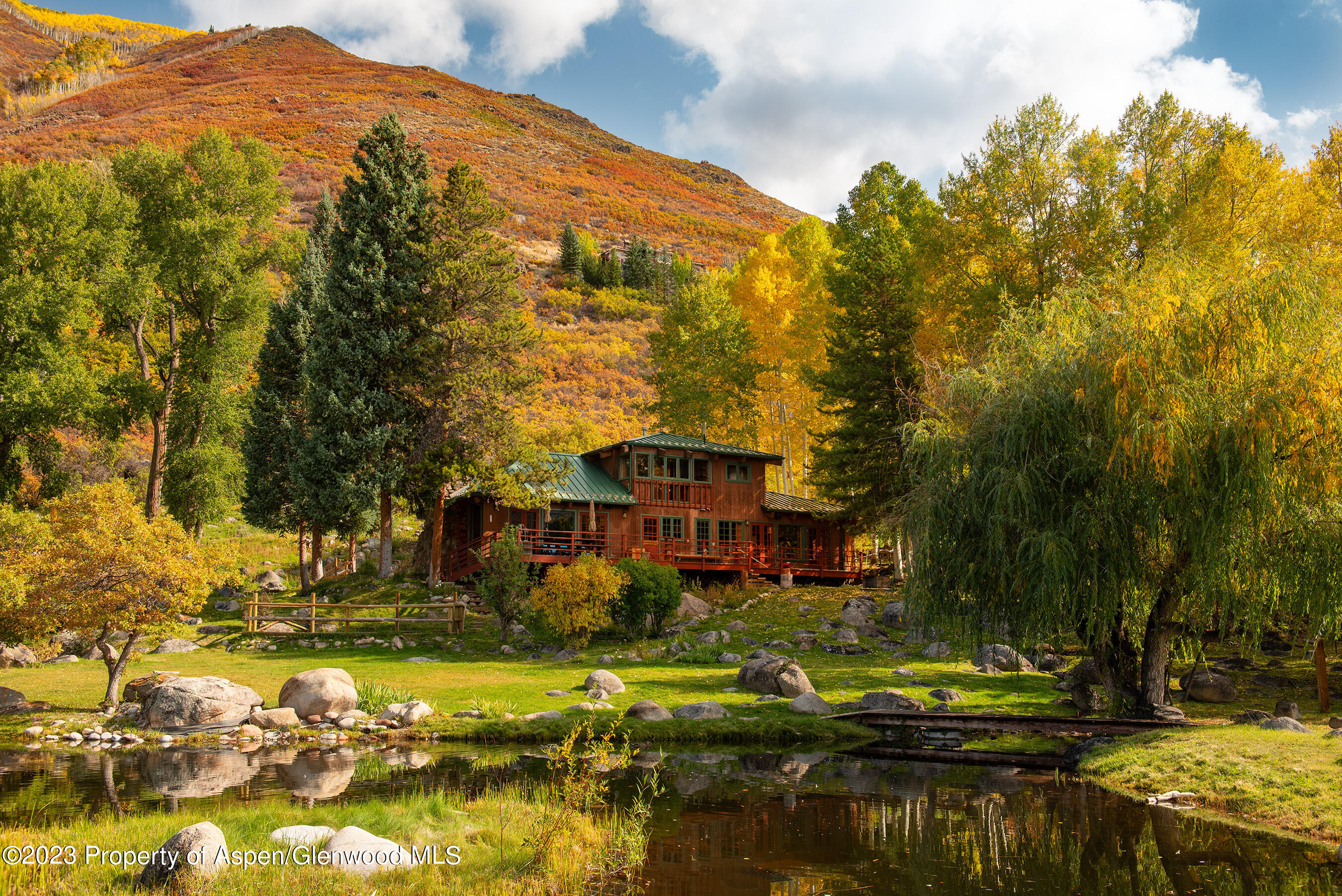 209 East Reds Road Aspen, CO 81612 - Photo 2 of 26 a view of a lake with a house in the background