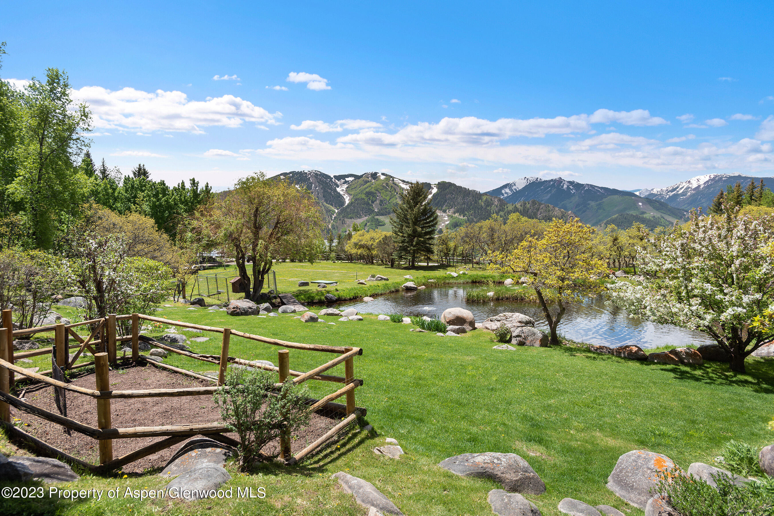 209 East Reds Road Aspen, CO 81612 - Photo 23 of 26 a view of a backyard with sitting area