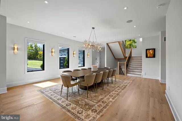 a view of a dining room with furniture and a window