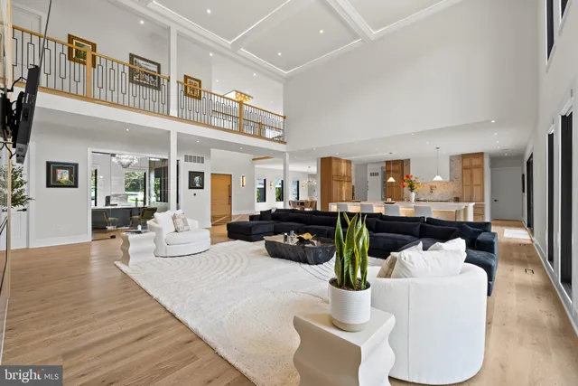 a large kitchen with kitchen island a large counter space a sink appliances and cabinets