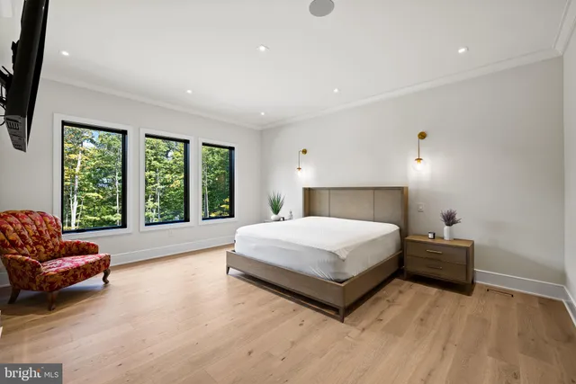a spacious bathroom with a tub sink and mirror