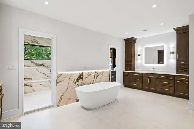 a bedroom with a large bed and a television