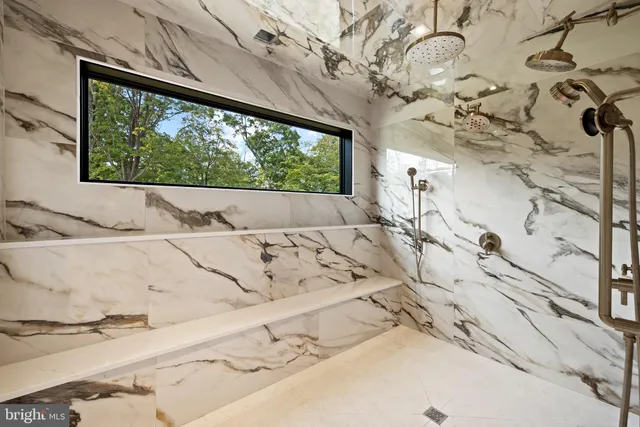 a bedroom with a large bed and a television