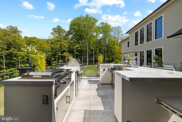 an aerial view of a house with big yard