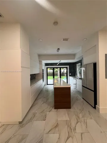 a lobby with furniture and a window