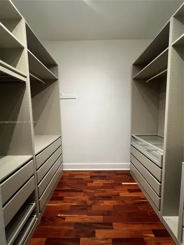 a view of an empty walk in closet