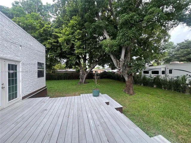 a view of backyard with a garden and entertaining space