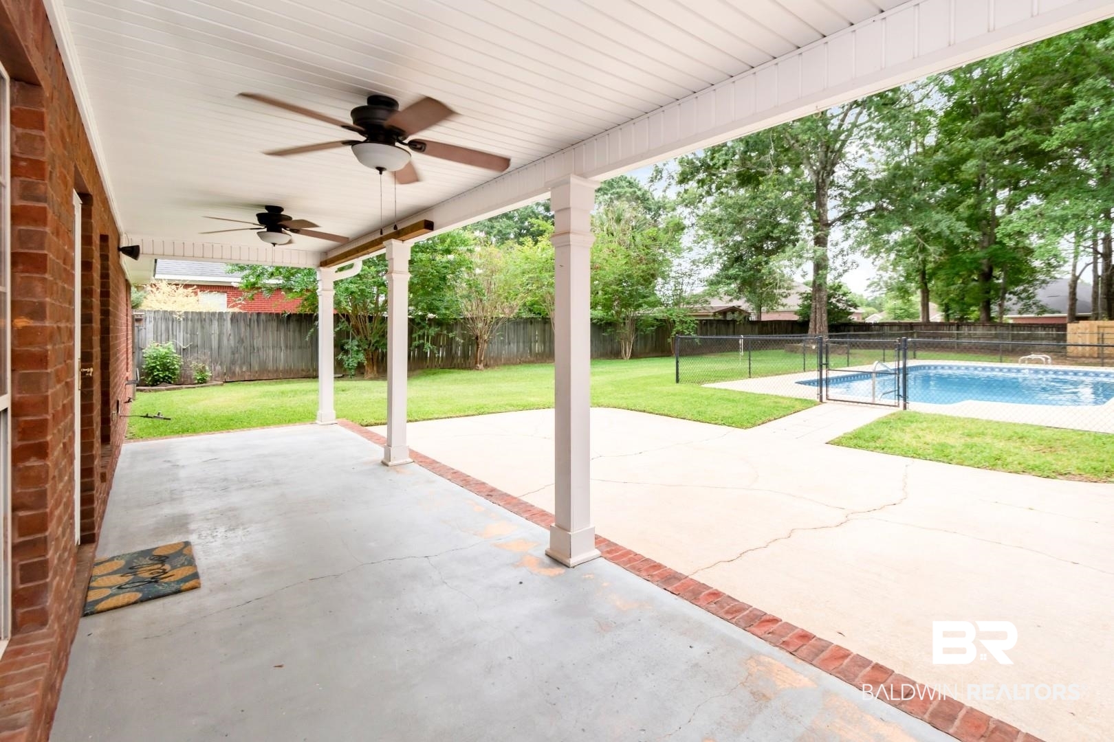 10691 Hunters Ridge Drive Mobile, AL 36695 - Photo 30 of 37 Spacious covered patio with ceiling fans and brick accents