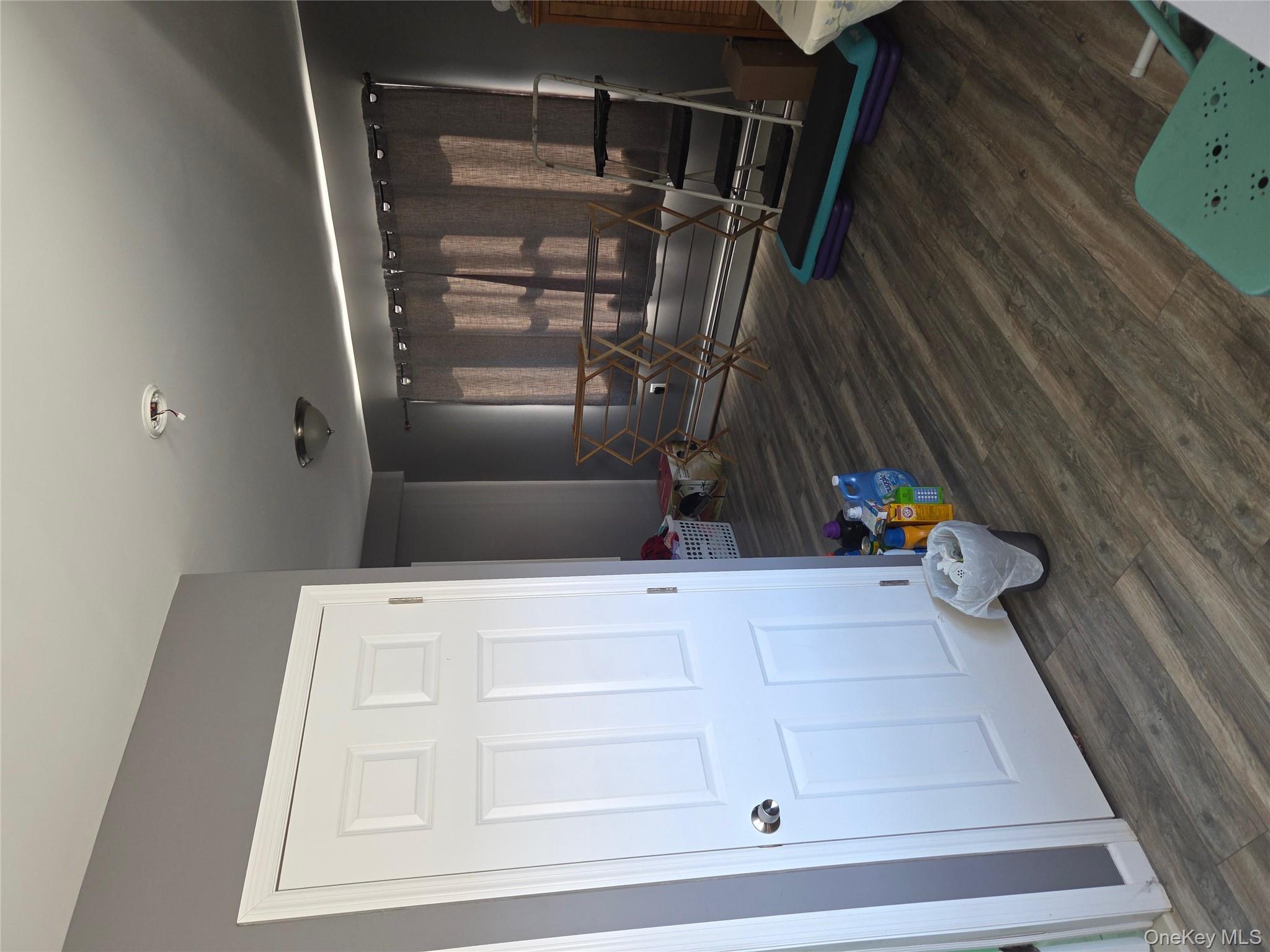 3095 Mullan Place Bronx, NY 10465 - Photo 12 of 12 Bedroom with dark wood-style floors and baseboard heating