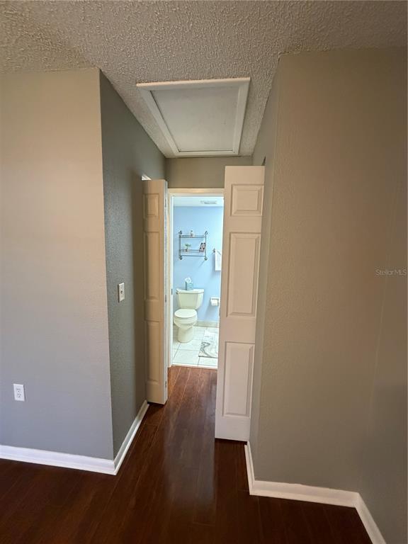 2131 Ridge Road South, Unit 135 Largo, FL 33778 - Photo 23 of 33 an empty room with wooden floor door and windows